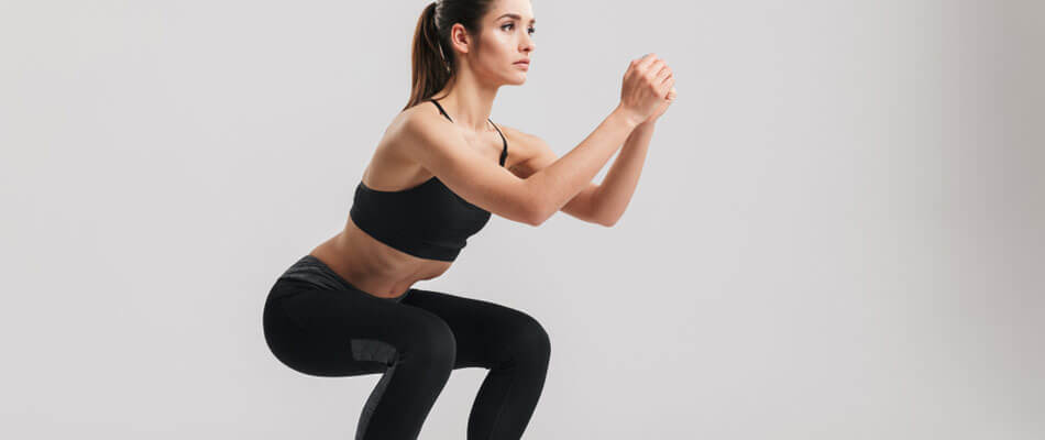 Squats er ideel til balder, lår, mave, ryg og din balanceevne.