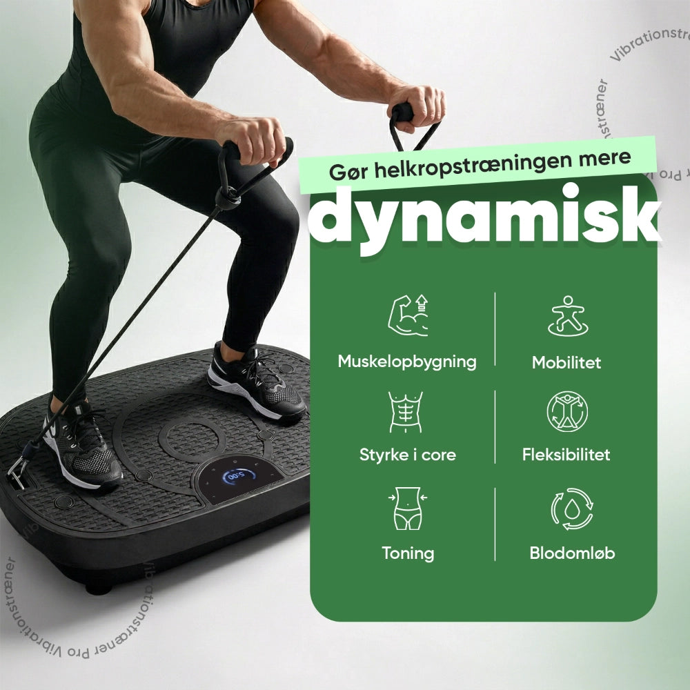 Vibrationstræner Pro på gulvet med træner i sneakers og håndtag til øvelser